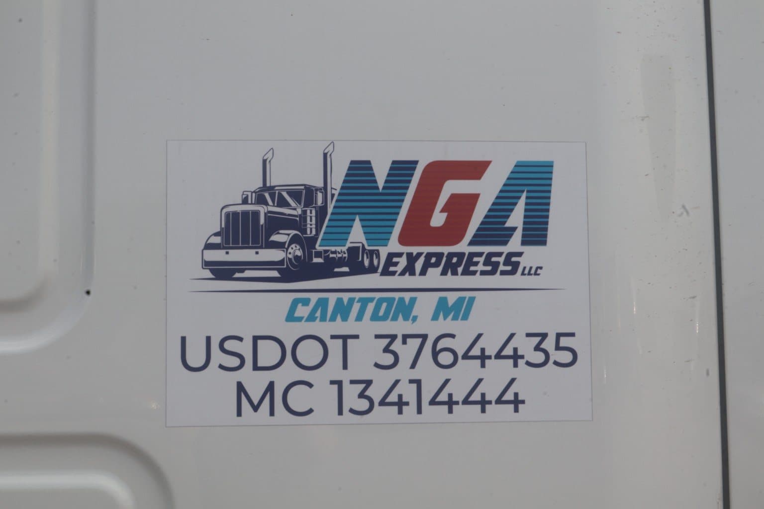 Close-up of NGA Express truck branding with USDOT and MC numbers.